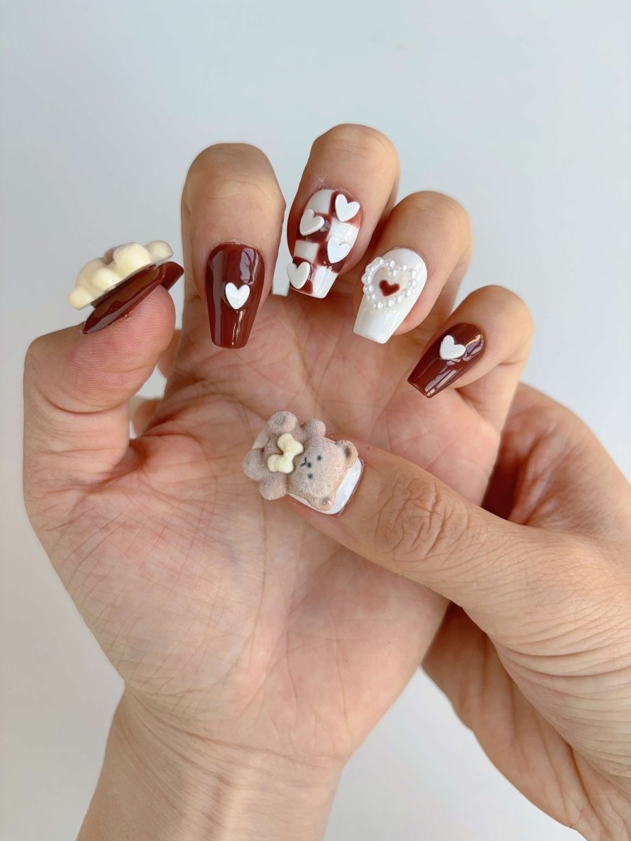Side view showing sculpted bear nail art and soft matte textures