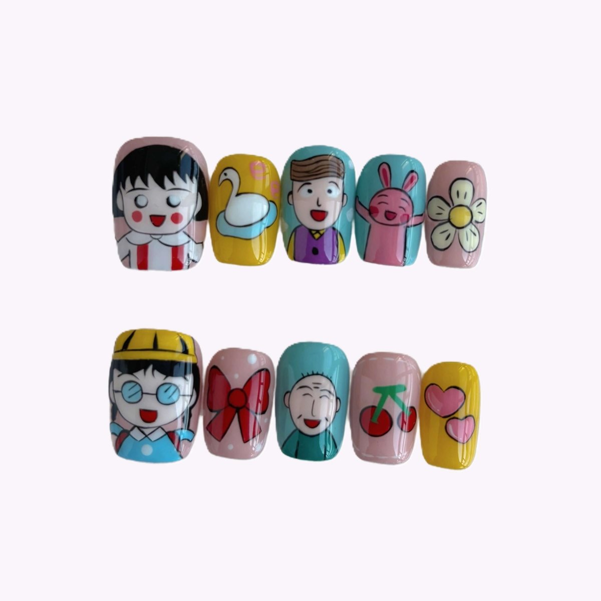 Hand-painted kawaii cartoon press-on nails featuring smiling characters, cherries, and hearts on pastel backgrounds