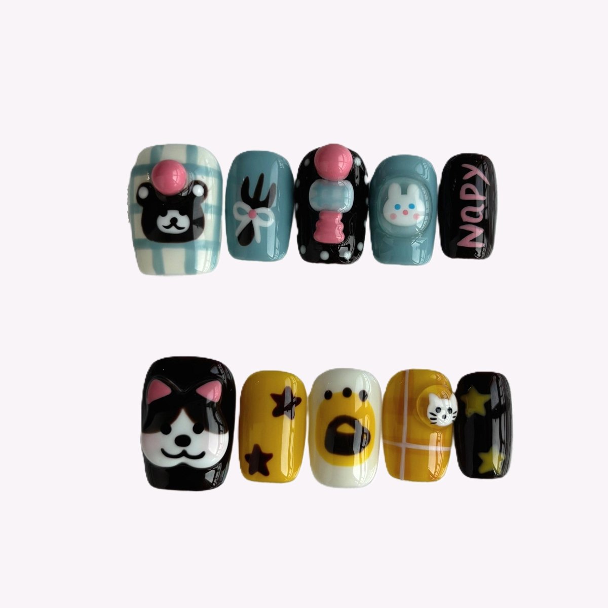 Mixed animal press-on nail set showing 10 unique nails with playful characters and glossy 3D details