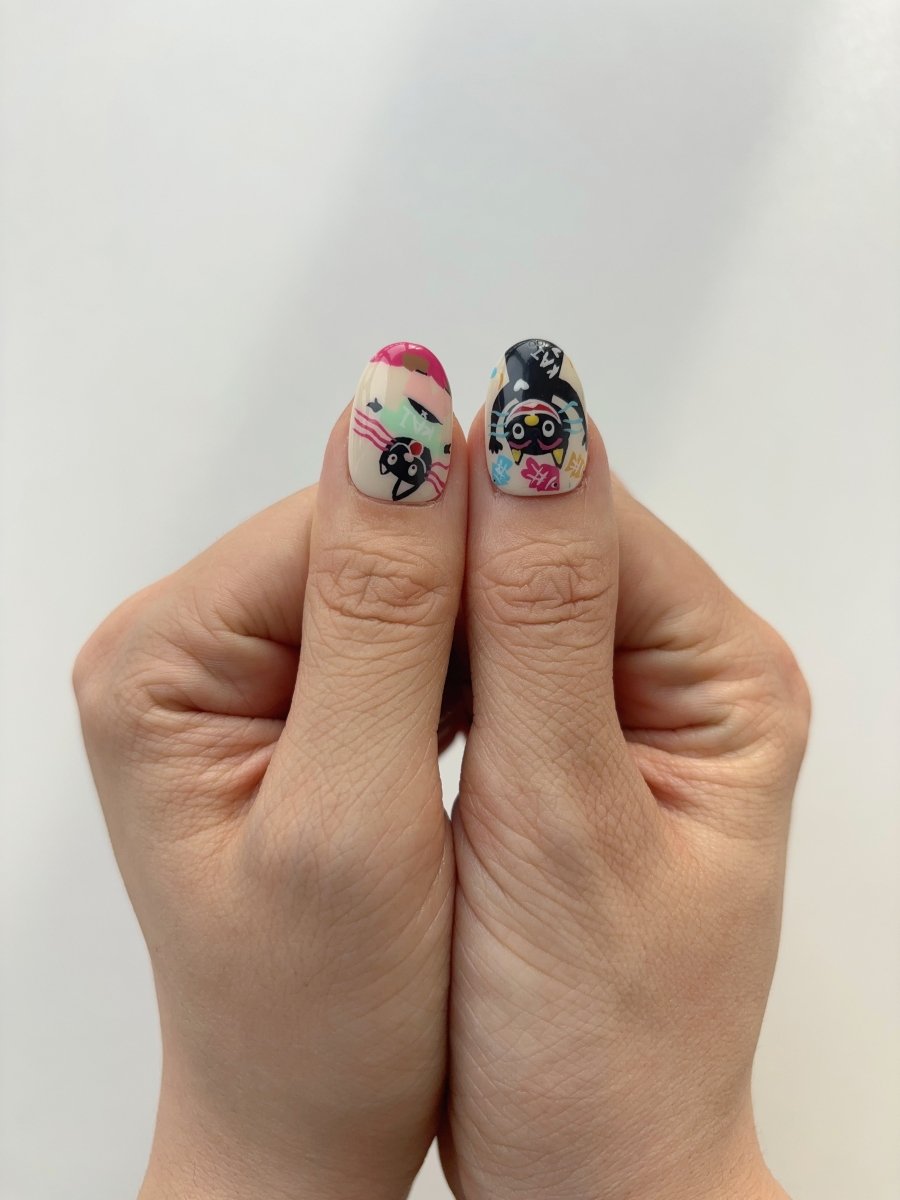 Black cat nail design with FISH word detail – kawaii press on nails