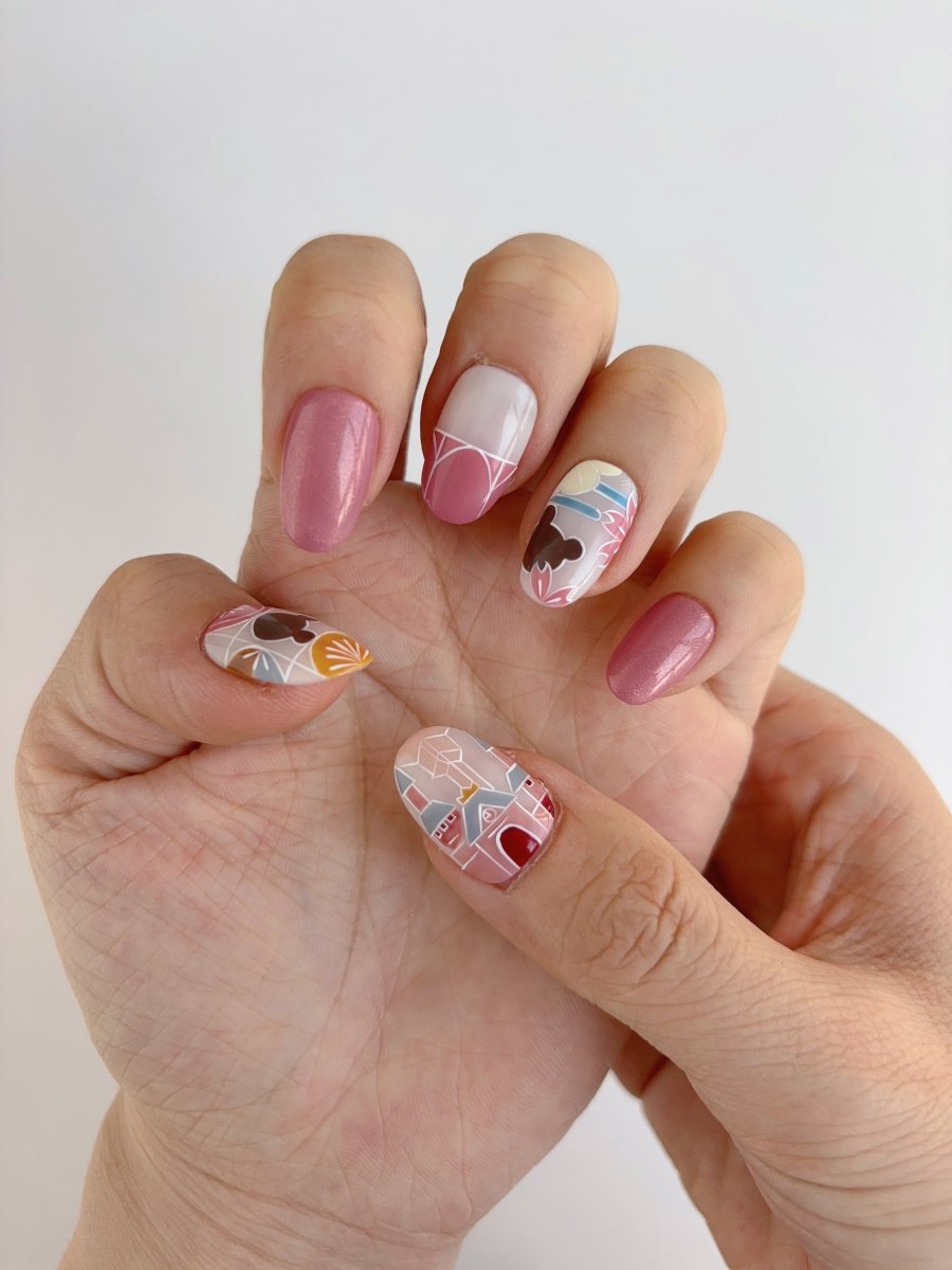 Close-up of Retro Park Vibes nail set featuring almond shape and playful illustrated details