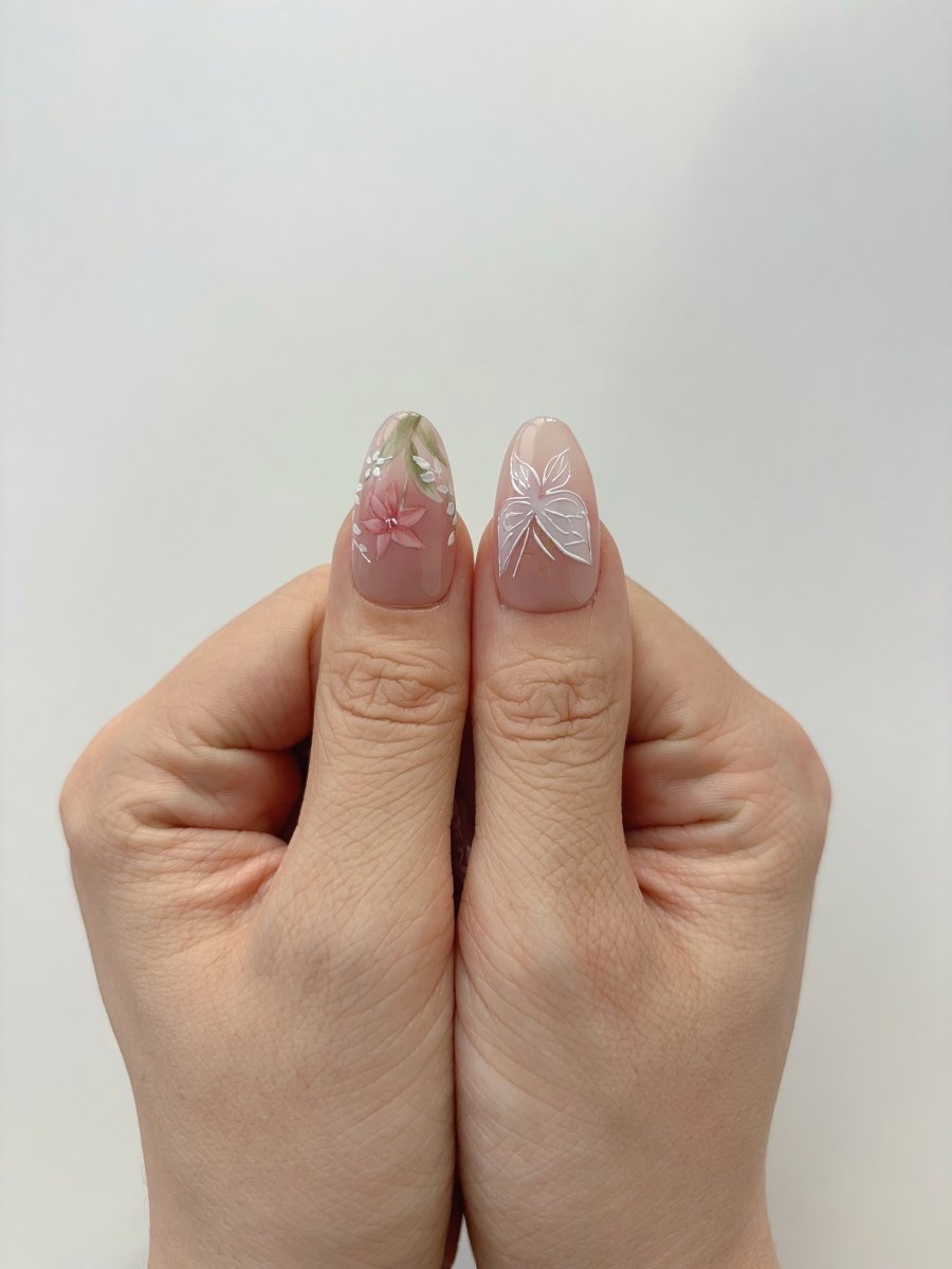 Spring wedding press on nails featuring delicate flowers and line art butterflies