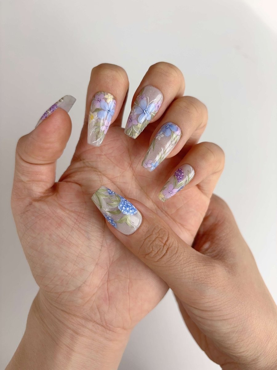 Full hand view showing Meadow Whispers floral design
