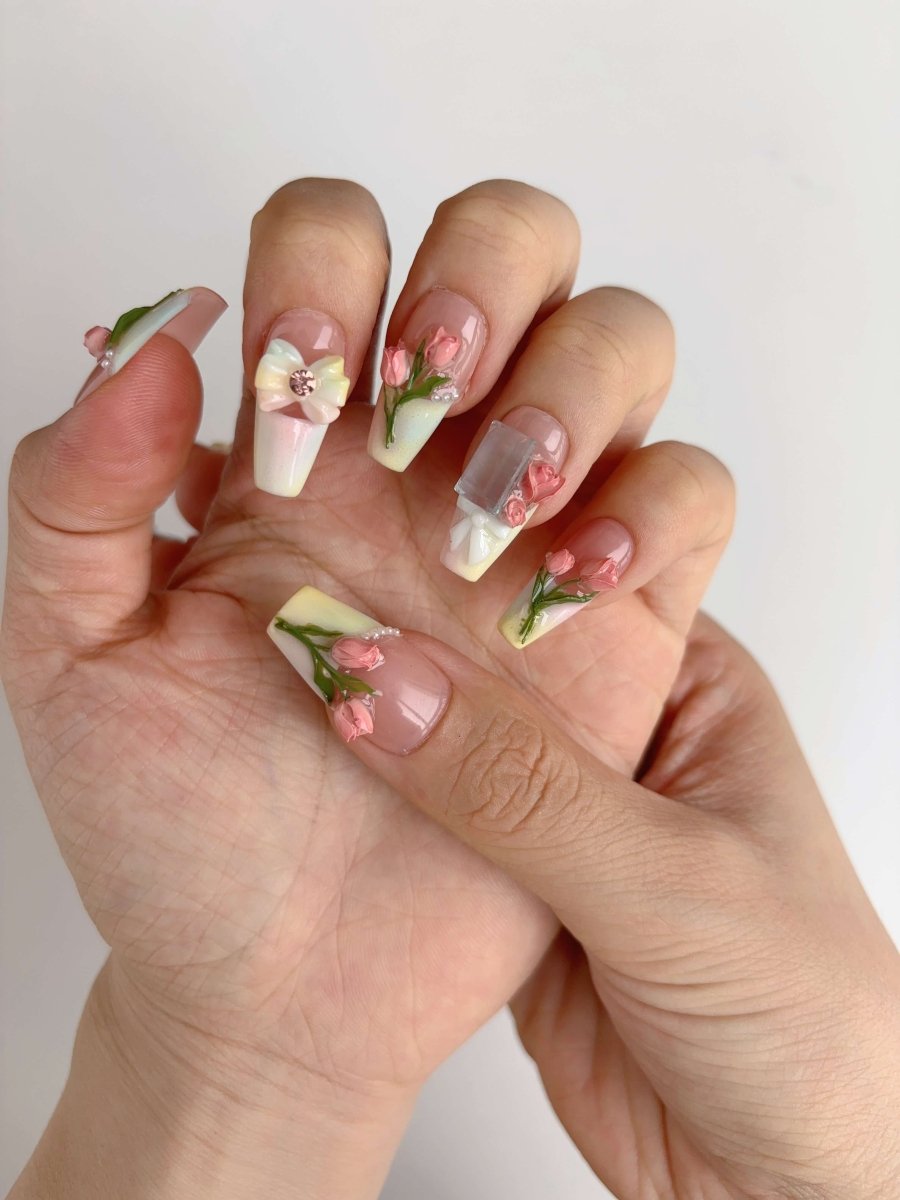Long coffin press-on nails with 3D pink rosebuds and iridescent bow accents