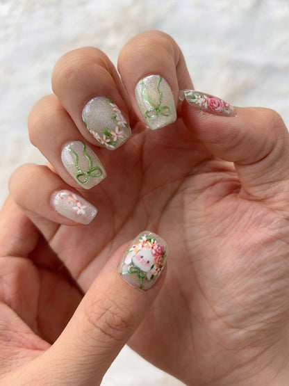Pastel spring press-on nails with floral and ribbon details from Nexus Nails