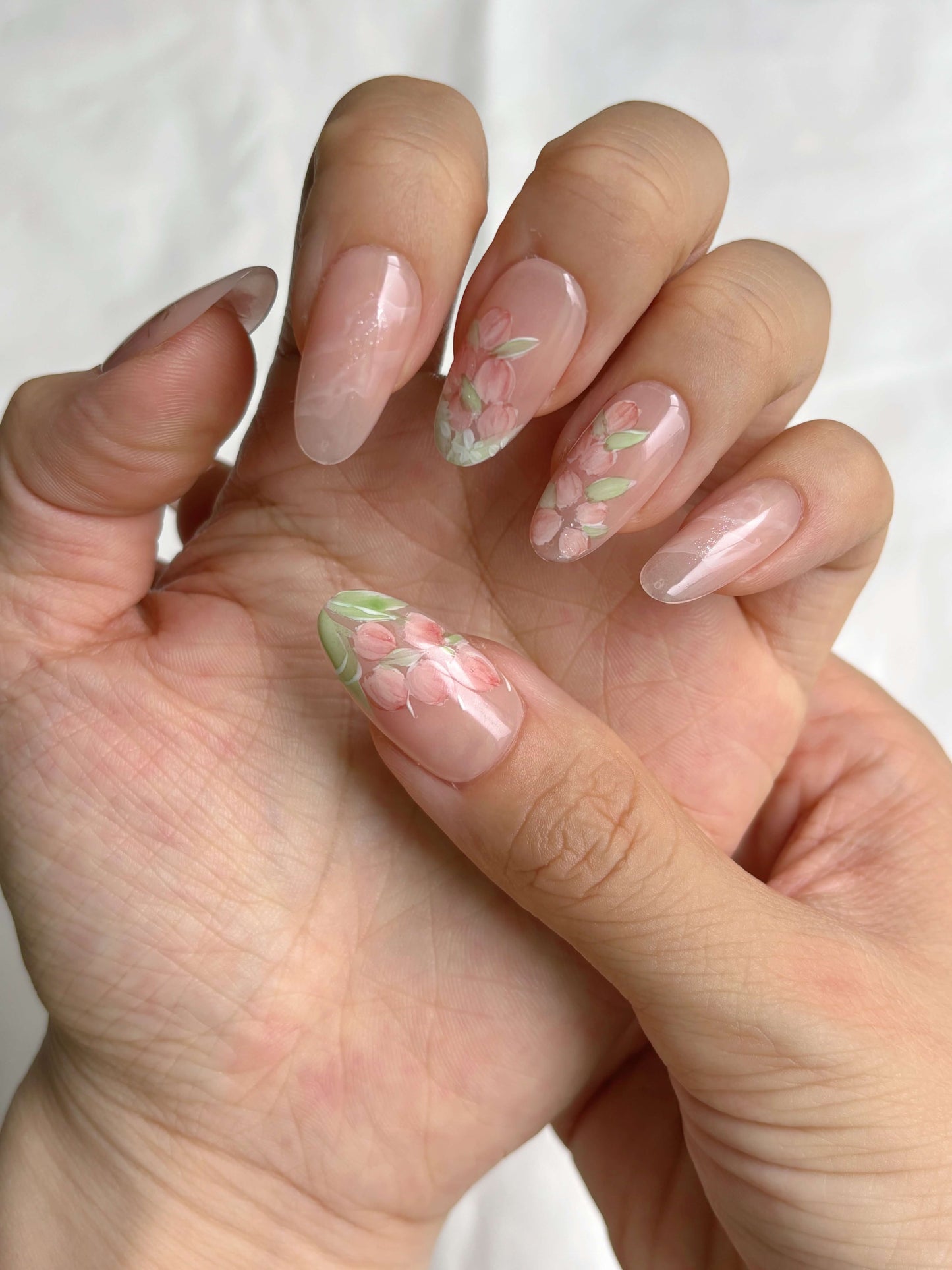 Hand wearing Petal Veil nails 