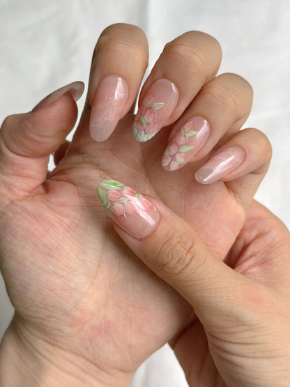 Hand wearing Petal Veil nails 