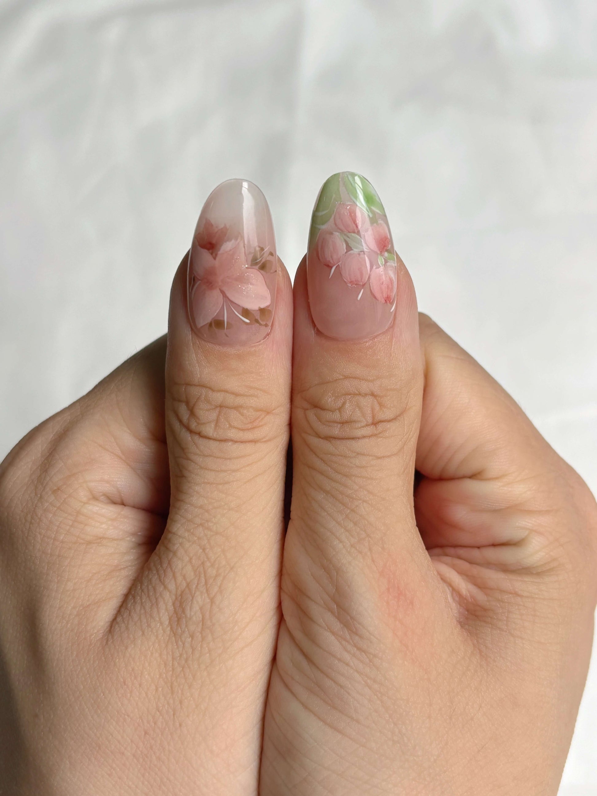 handcrafted Petal Veil nails in medium oval shape with floral details