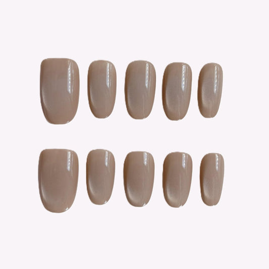 Glossy taupe magnetic cat eye nails in short oval shape