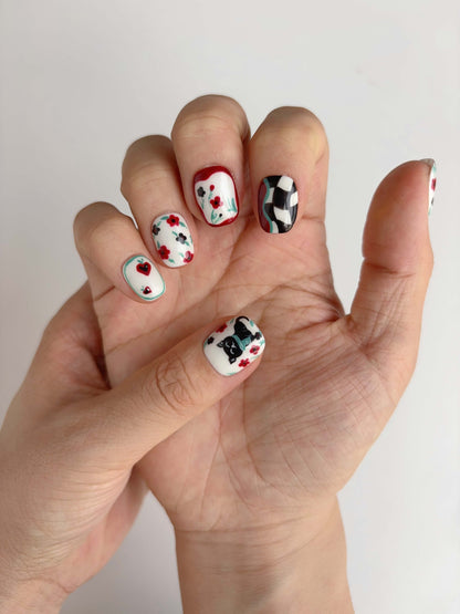 Full view of 10 Lucky Cat Bloom press-on nails laid out with illustrated designs