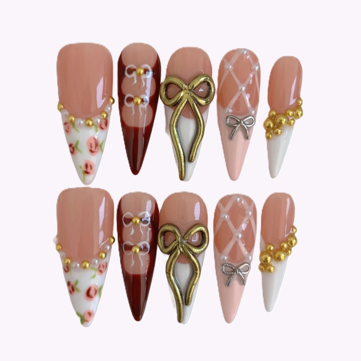 Full set of 10 press-on nails in a case with ballerina-inspired bows, roses, pearls, and corset-style linework